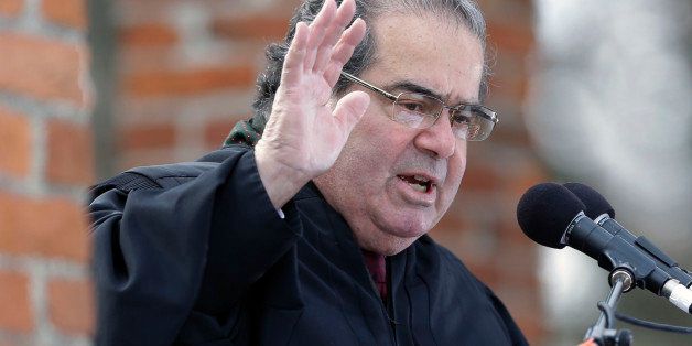 Supreme Court Justice Antonin Scalia administers the oath of allegiance to new citizens, during a ceremony commemorating the 150th anniversary of the dedication of the Soldiersâ National Cemetery and President Abraham Lincoln's Gettysburg Address, Tuesday, Nov. 19, 2013, in Gettysburg, Pa. Lincoln's speech was first delivered in Gettysburg nearly five months after the major battle that left tens of thousands of men wounded, dead or missing. (AP Photo/Matt Rourke)