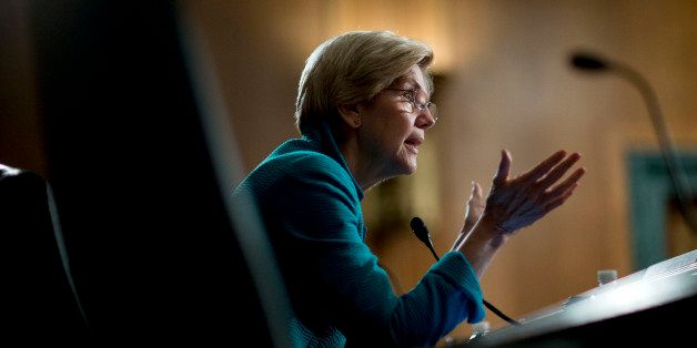 Senator Elizabeth Warren, a Democrat from Massachusetts, questions witnesses during a Senate Banking Committee hearing in Washington, D.C., U.S., on Tuesday, July 8, 2014. A technology arms race that risks destabilizing U.S. stock markets was triggered by regulations intended to promote competition among the exchanges, Wall Street executives told the Senate committee. Photographer: Andrew Harrer/Bloomberg via Getty Images 