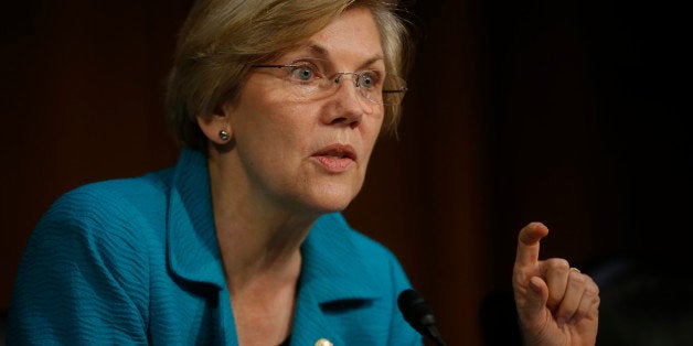 Sen. Elizabeth Warren, D-Mass., questions Treasury Secretary Jacob Lew as he testifies before the Senate Banking, Housing and Urban Affairs committee during a hearing to examine the Financial Stability Oversight Council annual report to Congress on Capitol Hill in Washington, Wednesday, June 25, 2014. (AP Photo/Charles Dharapak)