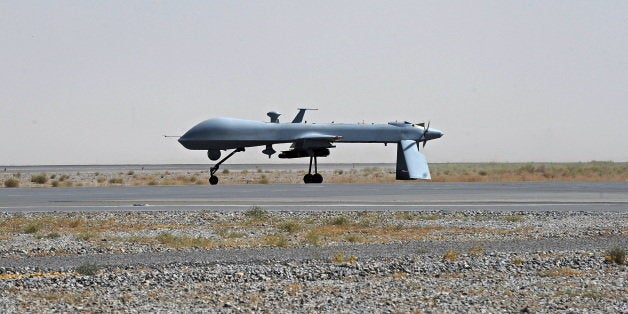 FILE - In this June 13, 2010, file photo a U.S. Predator unmanned drone armed with a missile stands on the tarmac of Kandahar