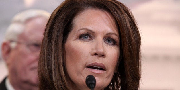 Rep. Michele Bachmann, R-Minn. speaks to reporters on Capitol Hill in Washington, Tuesday, March 25, 2014, after the Supreme Court heard arguments on a case involving family-owned companies that provide health insurance to their employees, but object to covering certain methods of birth control that they say can work after conception, in violation of their religious beliefs. (AP Photo/Lauren Victoria Burke)