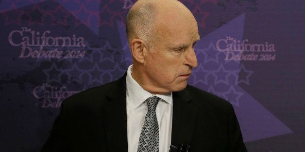 Gov. JerryÂ Brown sits at his podium before participating in a gubernatorial debate with Republican challenger Neel Kashkari in Sacramento, Calif., Thursday, Sept. 4, 2014. Thursday's debate is likely to be the only one of the general election. (AP Photo/Rich Pedroncelli, Pool)
