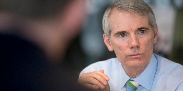 Senator Rob Portman, a Republican from Ohio, speaks during an interview in Washington, D.C., U.S., on Thursday, July 10, 2014. Portman, who may run for president in 2016, said Hillary Clinton's potential Democratic campaign for the White House won't intimidate others from seeking the office. Photographer: Andrew Harrer/Bloomberg via Getty Images 