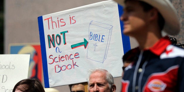 FILE - In this Sept. 17, 2013 file photo, pro-science supporters rally prior to a State Board of Education public hearing on proposed new science textbooks, in Austin, Texas. The Texas Board of Education is poised to tighten rules on who can serve on citizen review panels that scrutinize proposed textbooks for use statewide, hoping to tamp down future controversies over the teaching of evolution and other issues. (AP Photo/Eric Gay, File)