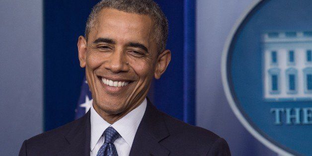 US President Barack Obama smiles after making a statement in the briefing room of the White House on August 1, 2014 in Washington. Obama declared that the US economy was getting stronger and had generated 'the longest streak of private sector job creation in history.' AFP PHOTO/Nicholas KAMM (Photo credit should read NICHOLAS KAMM/AFP/Getty Images)