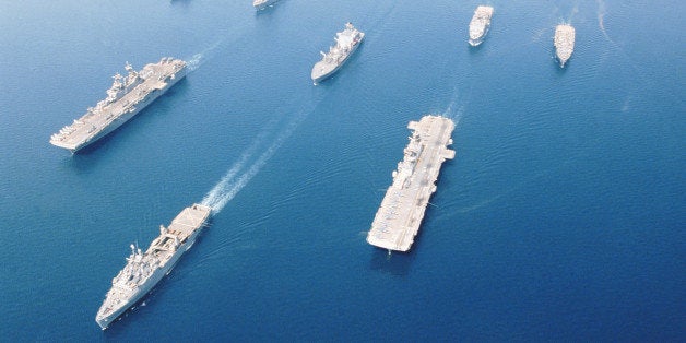 This combat ready fleet of ships, called Amphibious Task Force-West (ATF-West), is transporting Marines from San Diego to Kuwait. The ATF-West comprises of USS Bon Homme Richard, USS Boxer, USS Dubuque, USS Comstock, USS Anchorage, USS Pearl Harbor and USS Cleveland. They are in formation with Military Sealift Command oiler USNS Guadalupe.