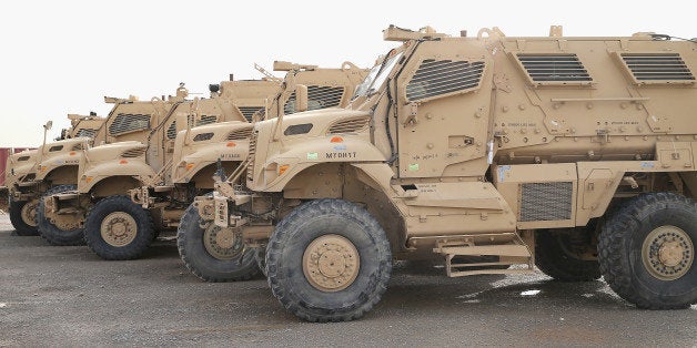 KANDAHAR, AFGHANISTAN - MARCH 08: MRAP vehicles sit in the Redistribution Property Accountability Team (RPAT) yard at Kandahar Airfield (KAF) on March 8, 2014 near Kandahar, Afghanistan. The RPAT facility is responsible for shipping military equipment back to the United States after it has been damaged or is no longer need in Afghanistan. The facility also redistributes equipment within the country if its needed by another unit. President Obama recently ordered the Pentagon to begin contingency planning for a pullout from Afghanistan by the end of 2014 if Afghanistan President Hamid Karzai or his successor refuses to sign the Bilateral Security Agreement. (Photo by Scott Olson/Getty Images)