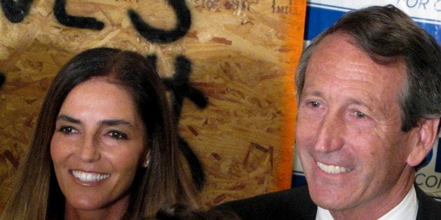 Maria Belen Chapur and her fiancee, former South Carolina Gov. Mark Sanford pose for a picture in Mount Pleasant, S.C., on Tuesday, April 2, 2013, after Sanford won the GOP nomination for the U.S. House seat he once held. Sanford is trying to make a comeback after his political career was derailed four years ago when he disappeared from the state only to return to admit the couple was having an affair. Sanford's wife, Jenny, later divorced him. (AP Photo/Bruce Smith)