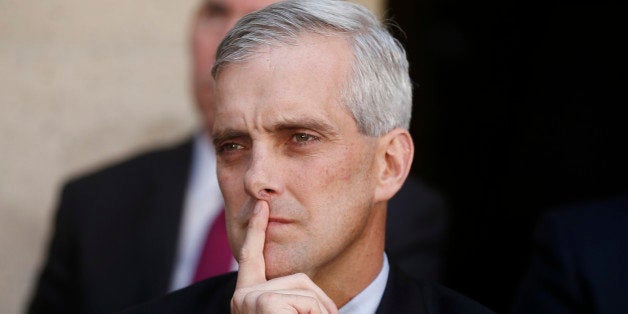 FILE - In this Oct. 28, 2013 file photo, White House Chief of Staff Denis McDonough listens as President Barack Obama speaks at FBI Headquarters in Washington. McDonough had been pushed to the edge by health care advocates anxious over the disastrous rollout of the health care law. For weeks, President Barack Obama and White House officials had been apologizing for and promising fixes to a faulty website and an unmet promise to insurance holders that they could keep their policies. âIâve had too much humble pie,â a frustrated McDonough said after yet another hand-wringing meeting. âThat was the last slice. Iâm full.â (AP Photo/Charles Dharapak, File)