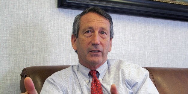 FILE - In this Dec. 18, 2013 file photo, U.S. Rep. Mark Sanford, R-S.C., discusses his first months back in Congress during an Associated Press interview in his district office in Mount Pleasant, S.C. Sanford said on Friday, Sept. 12, 2014, that he and his fiancee are calling off their engagement due to the ongoing contention with his ex-wife Jenny Sanford, four years after their divorce. (AP Photo/Bruce Smith, File)