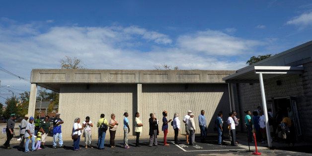 WILSON, NC - OCTOBER 18: People wait in line to vote at the Board of Elections early voting site on October 18, 2012 in Wilson, North Carolina. Today is the last day to register and the first day to vote for the election in North Carolina. (Photo by Sara D. Davis/Getty Images)