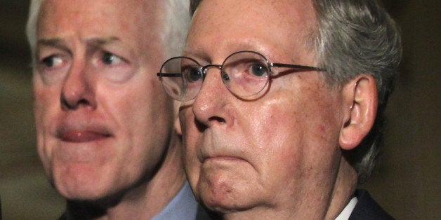 WASHINGTON, DC - SEPTEMBER 09: U.S. Senate Minority Leader Sen. Mitch McConnell (R-KY) (R) and Senate Minority Whip Sen. John Cornyn (R-TX) (L) listen during a media briefing after the Senate Republican weekly policy luncheon September 9, 2014 on Capitol Hill in Washington, DC. Senate Republicans held its week policy luncheon to discuss Republican agenda. (Photo by Alex Wong/Getty Images)