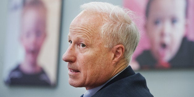 UNITED STATES - AUGUST 29: Rep. Mike Coffman, R-Colo., talks with officials during a tour of the University of Colorado Anschutz Medical Campus in Aurora, Colo., August 29, 2014. Coffman is being challenged by Democratic Andrew Romanoff for Colorado's 6th Congressional District seat. (Photo By Tom Williams/CQ Roll Call)