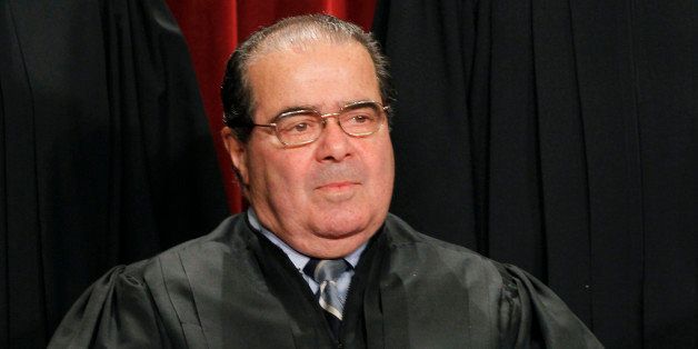 Associate Justice Antonin Scalia during the group portrait of the U.S. Supreme Court at the Supreme Court Building in Washington, Friday, Oct. 8, 2010. (AP Photo/Pablo Martinez Monsivais)