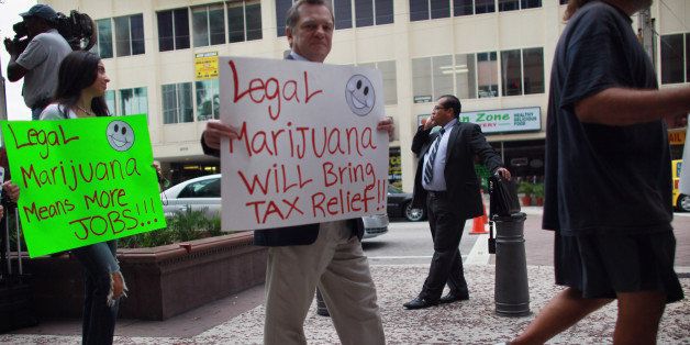 FORT LAUDERDALE, FL - OCTOBER 12: People march in support of the Florida Attorney General candidate, Jim Lewis, who is running on a platform of legalizing marijuana on October 12, 2010 in Fort Lauderdale, Florida. Lewis believes that legalizing the drug will save the state hundreds of millions of dollars that can be redirected for spending on education, environment, and other necessary items. (Photo by Joe Raedle/Getty Images)