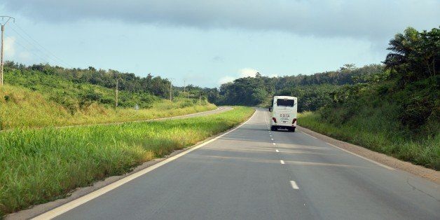 A bus drives on September 14, 2014 on the Abidjan-Yamoussoukro 230 kilometer-long motorway that opened on December 11, 2013. AFP PHOTO / ISSOUF SANOGO (Photo credit should read ISSOUF SANOGO/AFP/Getty Images)
