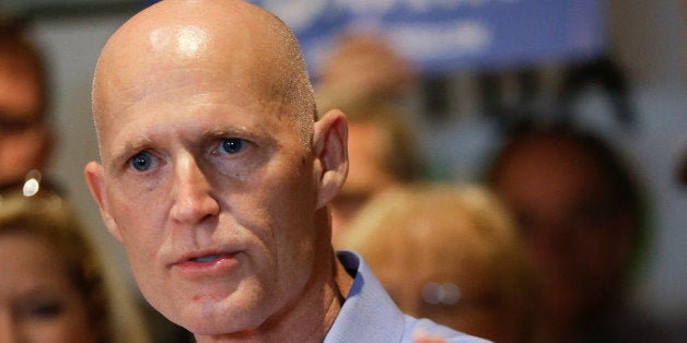 Florida Gov. Rick Scott speaks at a campaign event Monday, Sept. 8, 2014, in Winter Park, Fla. Scott is running against former Republican Gov. Charlie Crist, who is running as a Democrat in November's election for Florida governor. (AP Photo/John Raoux)