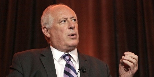 FILE - In this Aug. 28, 2014 file photo, Illinois Gov. Pat Quinn answers questions during the Metropolitan Planning Council's Annual Luncheon in Chicago. Quinn and his opponent Republican gubernatorial candidate Bruce Rauner, took personal and nasty jabs at each other during a televised side-by-side newspaper editorial board meeting Tuesday, Sept. 9, 2014 in Chicago. The tone during the nearly 90-minute debate-style meeting before the Chicago Tribune's editorial board was a clear sign the gloves are off in one of the most competitive governor's races nationwide.(AP Photo/M. Spencer Green.File)