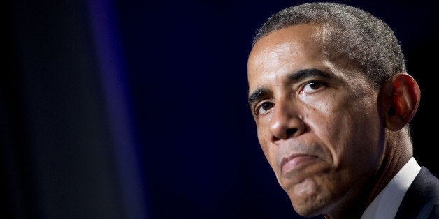 U.S. President Barack Obama pauses while speaking at the Democratic National Committee's (DNC) annual Women's Leadership Forum in Washington, D.C., U.S., on Friday, Sept. 19, 2014. Speaking at an event today at the White House, President Obama rolled out the 'It's On Us' campaign to encourage college students, especially men, to speak out against and prevent sexual assault on campuses. Photographer: Andrew Harrer/Bloomberg via Getty Images 