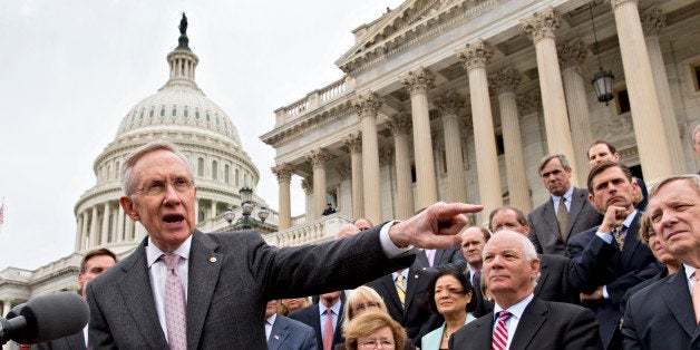 Senate Majority Leader Harry Reid, D-Nev., and Senate Democrats gather outside the Capitol to urge Speaker of the House John Boehner, R-Ohio, and other House Republicans, to break the impasse on a funding bill and stop the government shutdown that is now in its second week, Wednesday, Oct. 9, 2013, in Washington. With so many furloughed federal workers living in the Maryland and Virginia suburbs outside Washington, senators from those states made special pleas. From left are Sen. Reid, Sen. Barbara Mikulski, D-Md., Sen. Ben Cardin, D-Md., and Senate Majority Whip Dick Durbin, D-Ill. (AP Photo/J. Scott Applewhite)