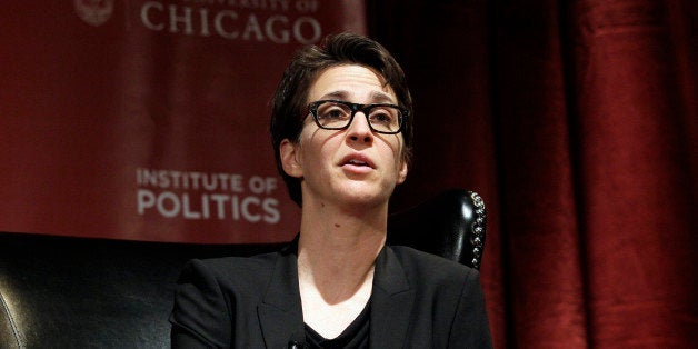 Rachel Maddow, host of "The Rachel Maddow Show" on MSNBC, shares a stage with pundits during a panel discussion, "2012: The P