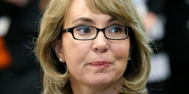 Former Arizona Congresswoman Gabrielle Giffords testifies before a Washington state House panel Tuesday, Jan. 28, 2014, in Ol
