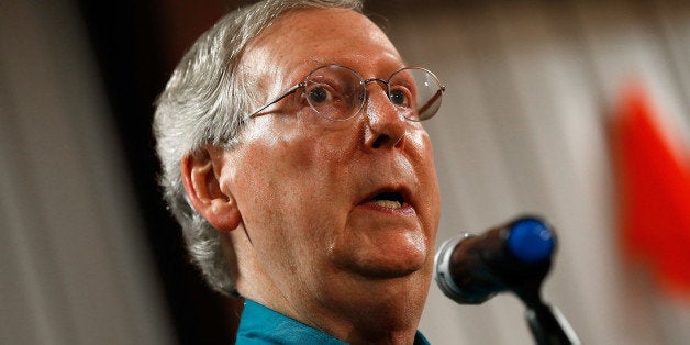 HAZARD, KY - AUGUST 07: Senate Minority Leader Mitch McConnell (R-KY) speaks to supporters while campaigning at a Rental Pro store during a two day bus tour of eastern Kentucky August 7, 2014 in Hazard, Kentucky. McConnell is locked in a tight race against Democratic challenger Kentucky Secretary of State Alison Lundergan Grimes. (Photo by Win McNamee/Getty Images)