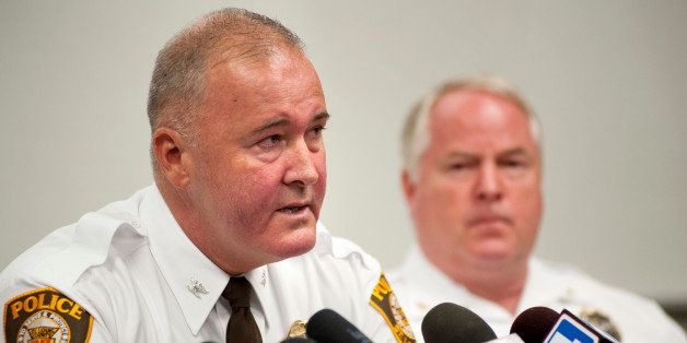 St. Louis County Police Chief Jon Belmar, left, delivers remarks as Ferguson Police Chief Thomas Jackson listens during a news conference Sunday, Aug. 10, 2014 in Ferguson, Mo., where the men addressed issues surrounding the shooting of Michael Brown, 18, by Ferguson police Saturday, Aug. 9, 2014. Brown died following a confrontation with police, according to Belmar. (AP Photo/Sid Hastings)