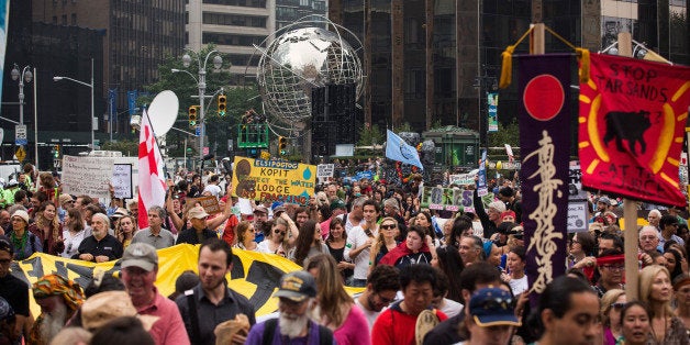 NEW YORK, NY - SEPTEMBER 21: People protest for greater action against climate change during the People's Climate March on September 21, 2014 in New York City. The march, which calls for drastic political and economic changes to slow global warming, has been organized by a coalition of unions, activists, politicians and scientists. (Photo by Andrew Burton/Getty Images)