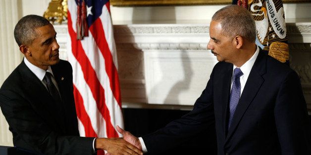 WASHINGTON, DC - SEPTEMBER 25: U.S. President Barack Obama (L) shakes hands with Attorney General Eric Holder (R) at a ceremony where Holder announced his resignation at the White House September 25, 2014 in Washington, DC. Holder has been led the Department of Justice since the beginning of the Obama administration in 2009 and plans to remain in office until his successor is named. (Photo by Win McNamee/Getty Images)