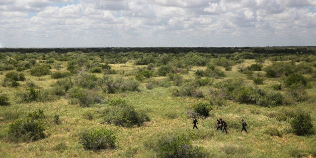 FALFURRIAS, TX - SEPTEMBER 11: U.S. Border Patrol agents detain undocumented immigrants after tracking them through the brush on September 11, 2014 near Falfurrias, Texas. Agents from U.S. Customs and Border Protection patrol the area day and night searching from smugglers bringing both illegal immigrants and drugs into the U.S. (Photo by John Moore/Getty Images)