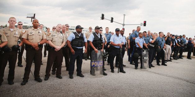 FERGUSON, MO - SEPTEMBER 10: Police block demonstrators from gaining access to Interstate Highway 70 on September 10, 2014 near Ferguson, Missouri. The demonstrators had planned to shut down I70 but their efforts were thwarted by a large contingent of police from several area departments. Ferguson, in suburban St. Louis, is recovering from nearly two weeks of violent protests that erupted after teenager Michael Brown was shot and killed by Ferguson police officer Darren Wilson last month. (Photo by Scott Olson/Getty Images)