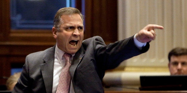 Illinois Rep. Mike Bost, R-Murphysboro, argues gun legislation while on the House floor during session at the Illinois State Capitol Wednesday, April 17, 2013, in Springfield Ill. (AP Photo/Seth Perlman)