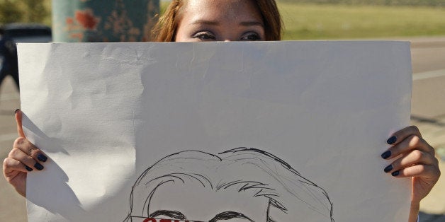 LITTLETON, CO - SEPTEMBER 24: Ava Tepi holds a sign as she joined other student during walkout for the third straight day after students from Chatfield High School and Dakota Ridge High School left classes in protest of school board decisions and proposals, September 24, 2014. Students for the two schools joined together, at the corner of Ken Caryl and Chatfield Blvd. in Littleton, to wave sings. (Photo by RJ Sangosti/The Denver Post via Getty Images)