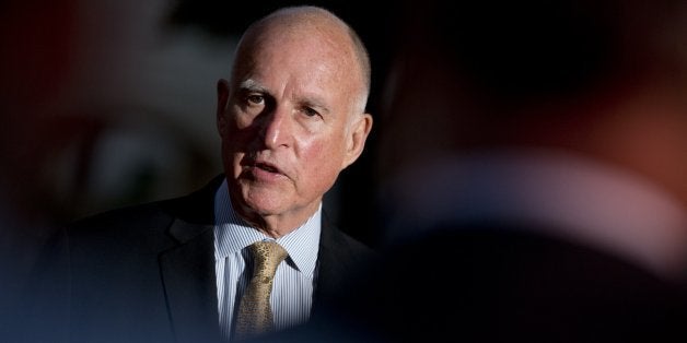 Gov. Jerry Brown talks to reporters outside the Old Governors Mansion on election night in Sacramento, Calif., Tuesday, June 3, 2014. (Jose Luis Villegas/Sacramento Bee/MCT via Getty Images)