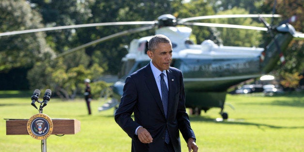 President Barack Obama walks from the podium after speaking about the participation of five Arab nations in airstrikes against militants in Syria., Tuesday, Sept. 23, 2014, on the South Lawn the White House, in Washington. The president said the participation of five Arab nations in airstrikes against militants in Syria "makes it clear to the world this is not America's fight alone." Afterward he and first lady Michelle Obama boarded Marine One for a short trip to Andrews Air Force Base, Md., then onto New York and the United Nations. (AP Photo/Carolyn Kaster)