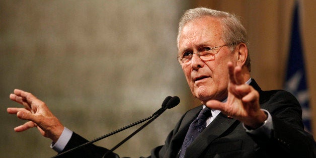 Former U.S. Secretary of Defense Donald Rumsfeld speaks to politicians and academics during a luncheon on security in rising