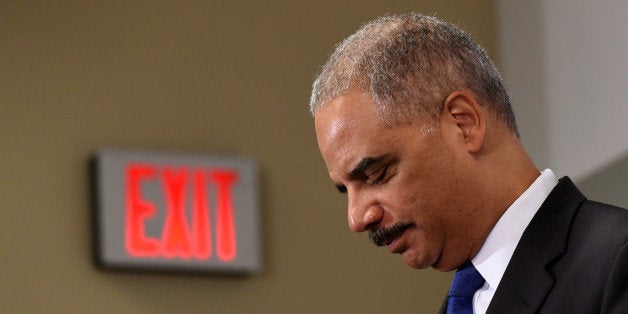 Outgoing Attorney General Eric Holder pauses while speaking at the Voting Rights Brain Trust event, Friday, Sept. 26, 2014, d