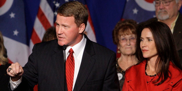 Republican Ohio Secretary of State-elect Jon Husted, left, with his wife Tina, speaks to a crowd of supporters at the Ohio Republican Party celebration Tuesday, Nov. 2, 2010, in Columbus, Ohio. (AP Photo/Jay LaPrete)