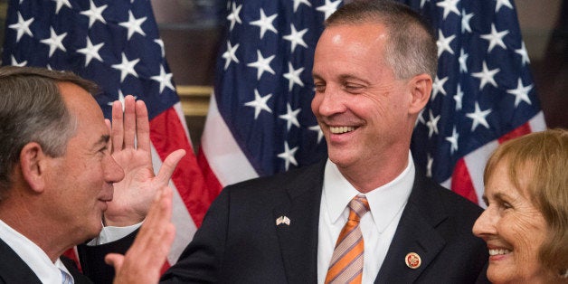 UNITED STATES - JUNE 25: From left, Speaker of the House John Boehner, Rep.-elect Curt Clawson, R-Fla., and his mother Cherie Clawson participate in the ceremonial swearing-in photo opportunity in the Capitol on Wednesday, June 25, 2014. (Photo By Bill Clark/CQ Roll Call)