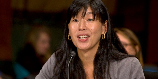 Ai-jen Poo, director of the National Domestic Workers Alliance, testifies at a Senate Judiciary Committee hearing on immigrant women and immigration reform on Capitol Hill in Washington, Monday, March 18, 2013. (AP Photo/Jacquelyn Martin)