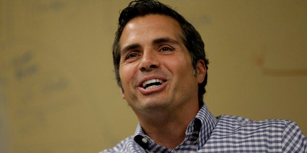 Independent U.S. Senate candidate Greg Orman talks to workers at a healthcare company, Wednesday, Sept. 10, 2014, Overland Pa