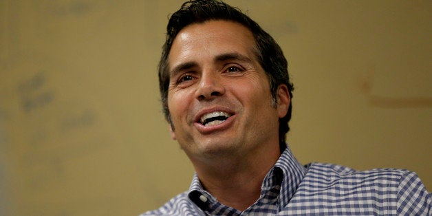 Independent U.S. Senate candidate Greg Orman talks to workers at a healthcare company, Wednesday, Sept. 10, 2014, Overland Park, Kan. Orman is challenging three-term incumbent Sen. Pat Roberts, R-Kan. (AP Photo/Charlie Riedel)