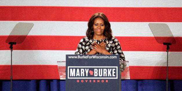 First lady Michelle Obama speaks on behalf of Wisconsin Democratic gubernatorial candidate Mary Burke at a campaign rally Monday, Sept. 29, 2014, in Milwaukee. (AP Photo/Darren Hauck)