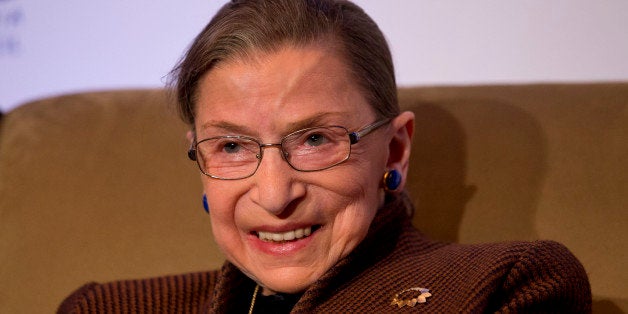 Supreme Court Justice Ruth Bader Ginsburg smiles while speaking to the Northern Virginia Technology Council, Tuesday, Dec. 17, 2013, in Reston, Va. She took part in what event organizers describe as a "fireside chat" with former U.S. Solicitor General Ted Olson. Olson served as solicitor general from 2001 to 2004 under President George W. Bush and is still a frequent advocate before the court. (AP Photo/Jacquelyn Martin)