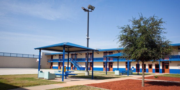 KARNES CITY, TX - JULY 31: The Karnes County Residential Center is viewed on July 31, 2014 in Karnes City, Texas. The civil facility is being used by U.S. Immigration and Customs Enforcement (ICE) to accomodate the increase of adults with children who have been apprehended illegally crossing the Southwest border. (Photo by Drew Anthony Smith/Getty Images)