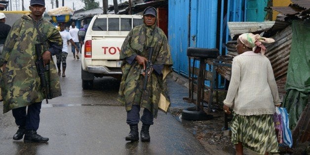 Liberian soldiers patrol in Monrovia's West Point slum on September 6, 2014. The death toll from the Ebola epidemic has climb