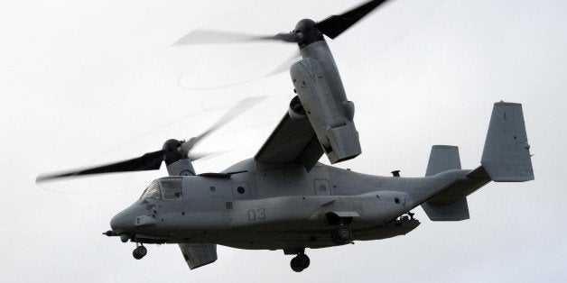 TO GO WITH AFP STORY BY REMY ZAKAAn American multi-mission and tiltrotor aircraft MV-22 Osprey, is pictured during a Franco-American military exercise called 'Garrigues Fury 2014' with soldiers of the US Special Purpose Marine Air Ground Task Force for Crisis Response, (SPMAGTF-CR), and soldiers of the French 21st Marine Infantry Regiment (RIMa) on February 13, 2014 at the military camp of Garrigues, near Nimes, southern France. The SPMAGTF-CR, was created after the armed attack against the U.S. consulate in Benghazi, Libya, in September 2012, in which four people, including the U.S. ambassador, perished. The mission of SPMAGTF-CR is to intervene rapidly in Africa. The objective of the exercise is to share the techniques and methods of action used in urban warfare. A AFP PHOTO / PASCAL GUYOT (Photo credit should read PASCAL GUYOT/AFP/Getty Images)