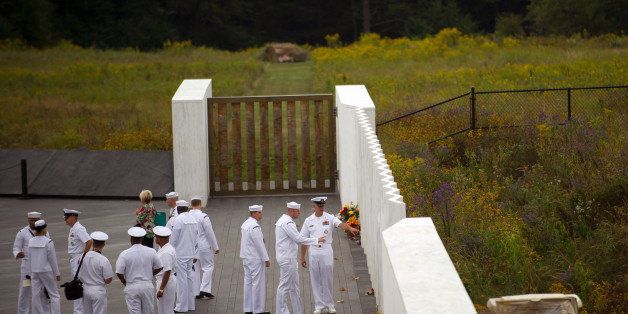 SHANKSVILLE, PA - SEPTEMBER 11: A group of US Navy men gather during 13th anniversary ceremonies commemorating the September 11th attacks were conducted at the Wall of Names at the Flight 93 National Monument September 11, 2014 in Shanksville, Pennsylvania. This year marks the 13th anniversary of the September 11th terrorist attacks that killed nearly 3,000 people at the World Trade Center, Pentagon and on Flight 93. (Photo by Jeff Swensen/Getty Images)