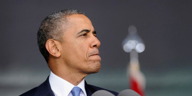 President Barack Obama pauses while delivering the commencement address to the U.S. Military Academy at West Point's Class of 2014, in West Point, N.Y., Wednesday, May 28, 2014. In a broad defense of his foreign policy, the president declared that the U.S. remains the world's most indispensable nation, even after a "long season of war," but argued for restraint before embarking on more military adventures. (AP Photo/Susan Walsh)